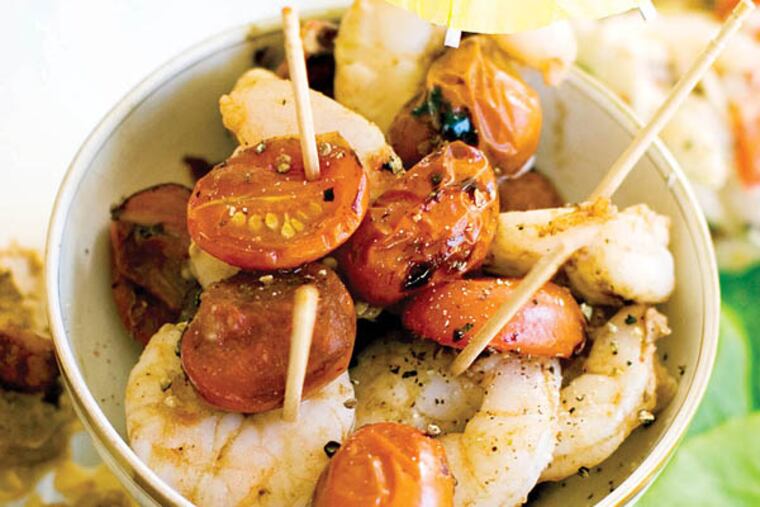 This Nov. 18, 2013 photo shows roasted shrimp cocktail, pinapple chicken lettuce wraps, and Elvis phyllo cups in Concord, N.H. (AP Photo/Matthew Mead)