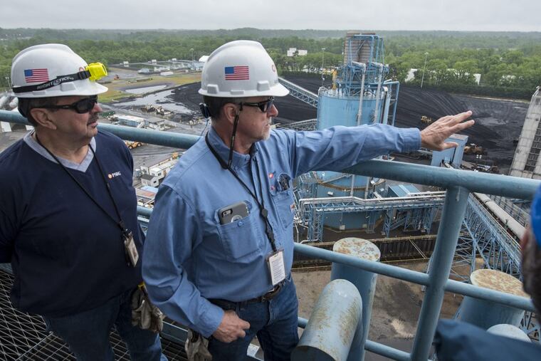 George LaFalce (right), the operations manager of PSEG’s Mercer Generating Station, and Mark Schwartzkopf, environmental manager, survey the plant, which will be retired on Thursday. The two men, who together have 76 years of service, will also retire when the plant shuts down.