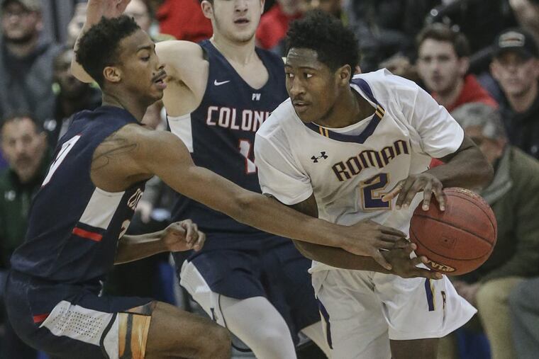 Roman Catholic’s Allen Betrand keeps the ball from Plymouth Whitemarsh’s Ish Horn in Wednesday’s PIAA Class 6A second-round playoff.