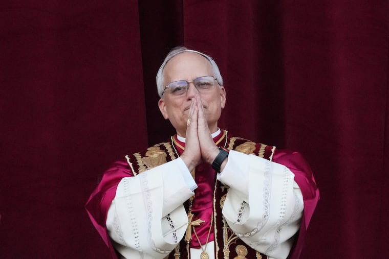 Newly elected Pope Leo XIV appears at the balcony of St. Peter's Basilica at the Vatican Thursday.
