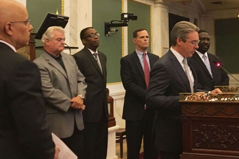 City Commissioners Al Schmidt (at podium) and Anthony Clark (right) join other city officials to discuss the Nov. 8 election.