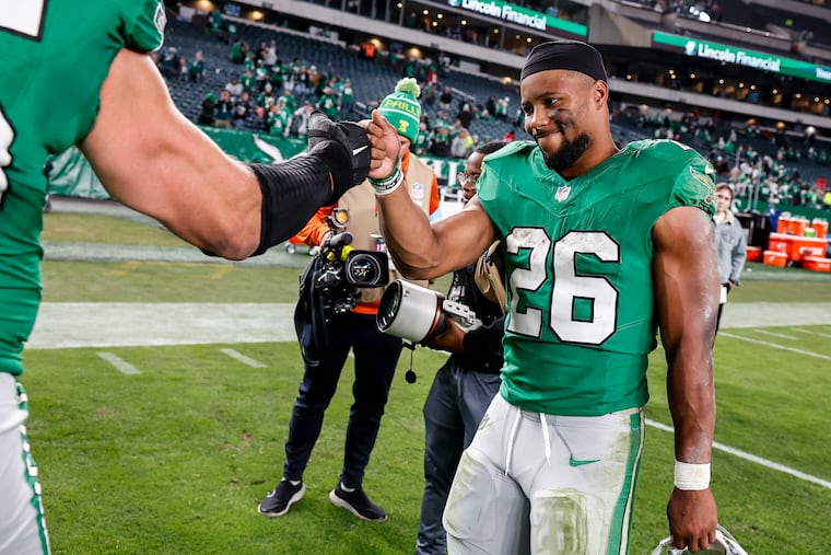 Philadelphia Eagles offensive tackle Lane Johnson greets running back Saquon Barkley after the game against the Jacksonville Jaguars at Lincoln Financial Field on Sunday, Nov. 3, 2024 in Philadelphia. The Philadelphia Eagles defeated the Jacksonville Jaguars 28 to 23.