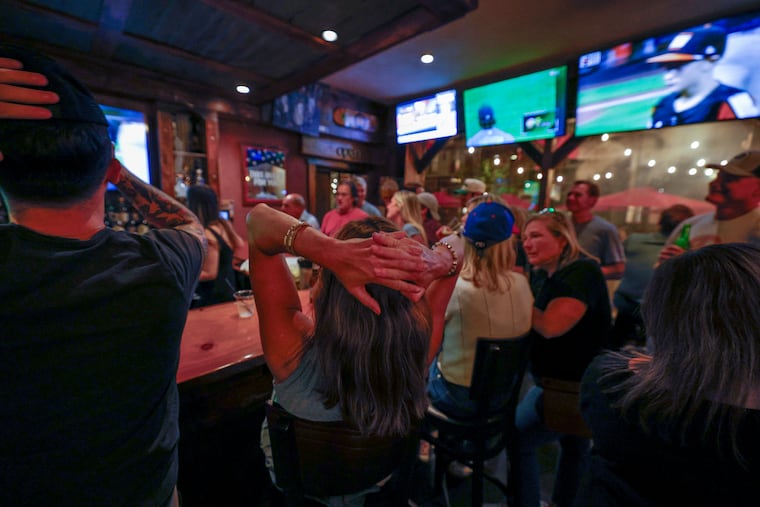 East Side Little League fans react during a watch part at Saloon 151 for the West Chester-based team.
