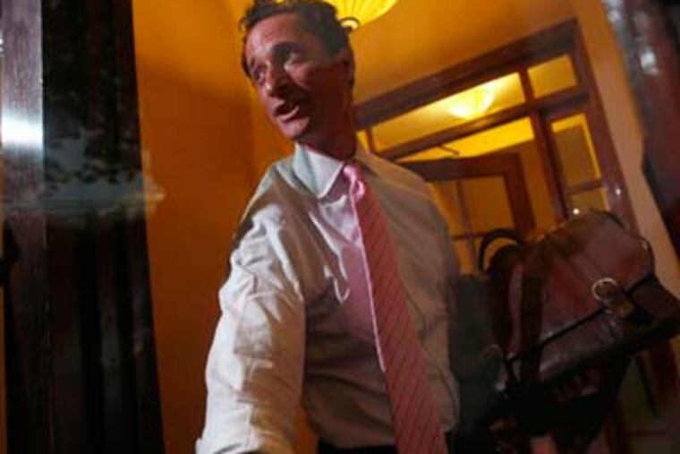 Rep. Anthony Weiner, D-N.Y., closes the front door of his building on reporters as he arrives at his house in the Queens borough of New York, Thursday, (AP Photo/Mary Altaffer)