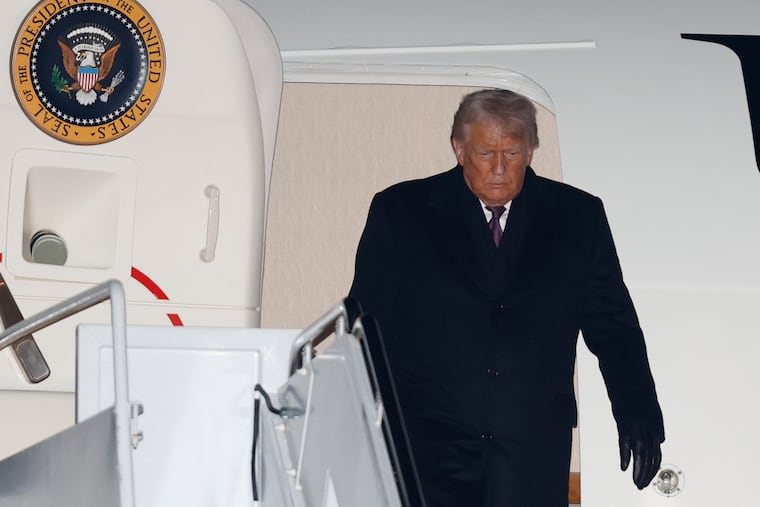 President Donald Trump arrives on Air Force One at Joint Base Andrews, Md., Thursday, Jan. 22, 2026, after returning from the World Economic Forum in Davos.