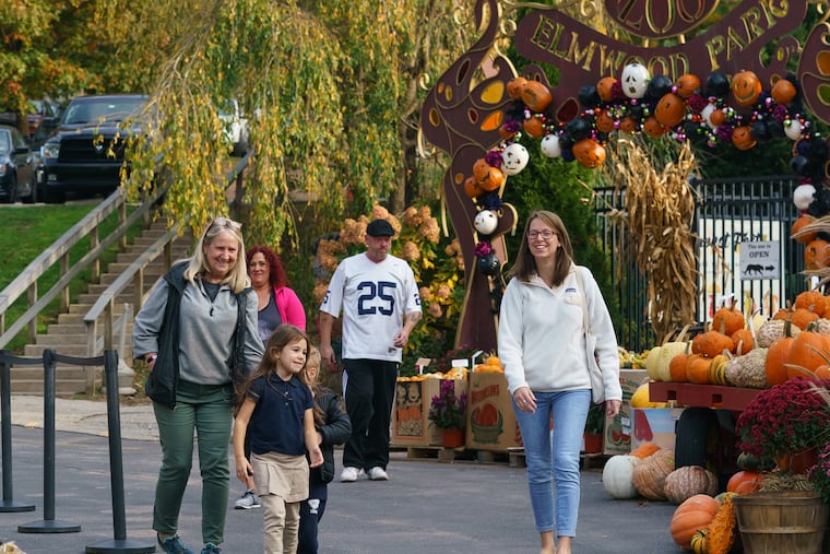Three generations, Wendi Wetzel, front left, grandmother, Jane Dunne, front, granddaughter, and Patti Dunne, front right, daughter, at the Elmwood Zoo, which is nearing it's 95th anniversary, in Norristown, October 25, 2019. JESSICA GRIFFIN / Staff Photographer.