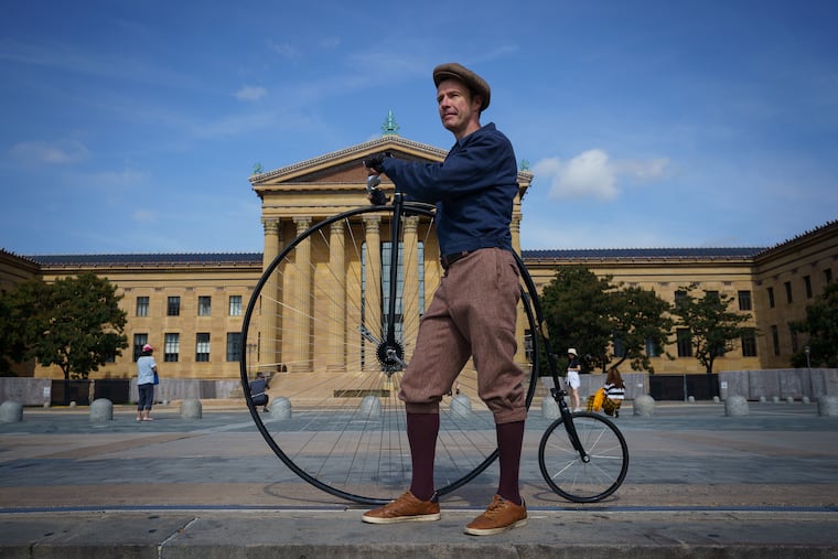 Paul Salter with his penny-farthing bicycle at the Philadelphia Museum of Art.