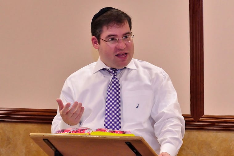JROSH24e Rabbi Tzvi Serebrowski teaches a small class of Jews on Monday, September 22, 2014, about the whys and wherefores of Jewish prayer and practice at the Torah Lights Synagogue in Cherry Hill, N.J. C.F. Sanchez / Staff Photographer