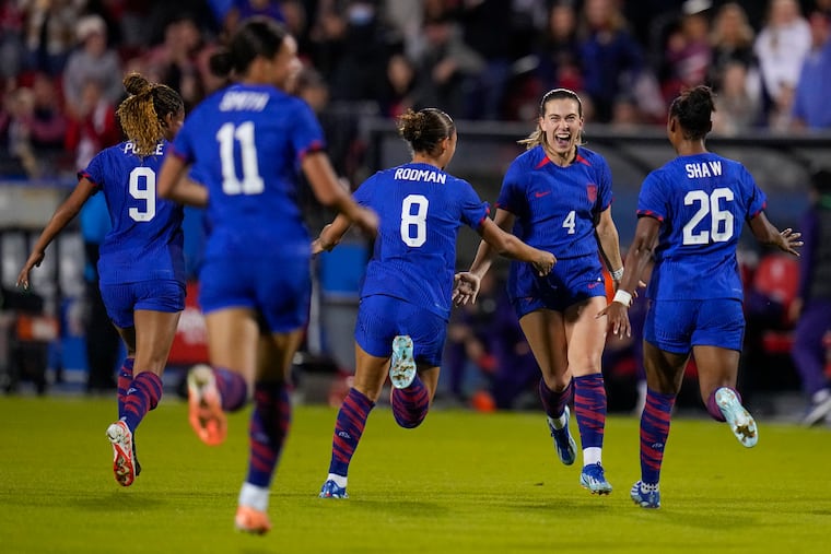 Sam Coffey (second from right) celebrates scoring her first U.S. national team goal.
