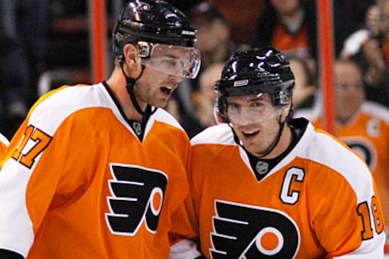 Mike Richards (right) and Jeff Carter were traded in separate deals last month. (Matt Slocum/AP Photo)
