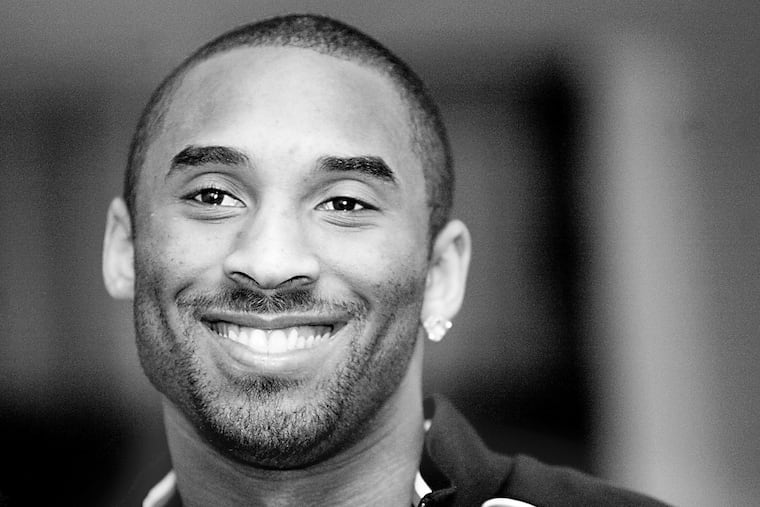 Kobe Bryant visited Vaux Middle School, where his uncle Chubby Cox was the basketball coach, to help with a trophy presentation for the basketball team ini 2005.