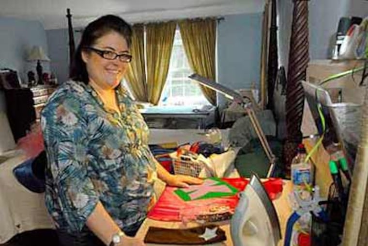 Sherry Aikens, who makes children's clothing in her home, says the cost of complying with the safety rule would be prohibitive. (April Saul / Staff Photographer)