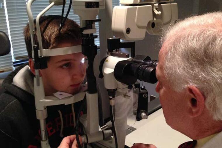 Richie Hartzel gets a checkup from ophthalmologist Steven Siepser, who tells his patient that he must avoid more trauma.