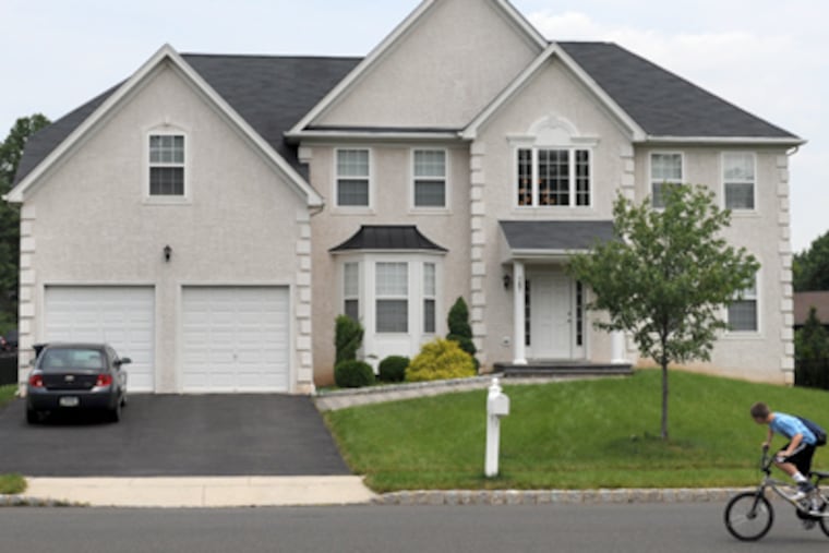 A man murdered his wife and 7-year old son with a baseball bat at this home on Redstone Drive in Warrington. (Tom Gralish / Staff Photographer)