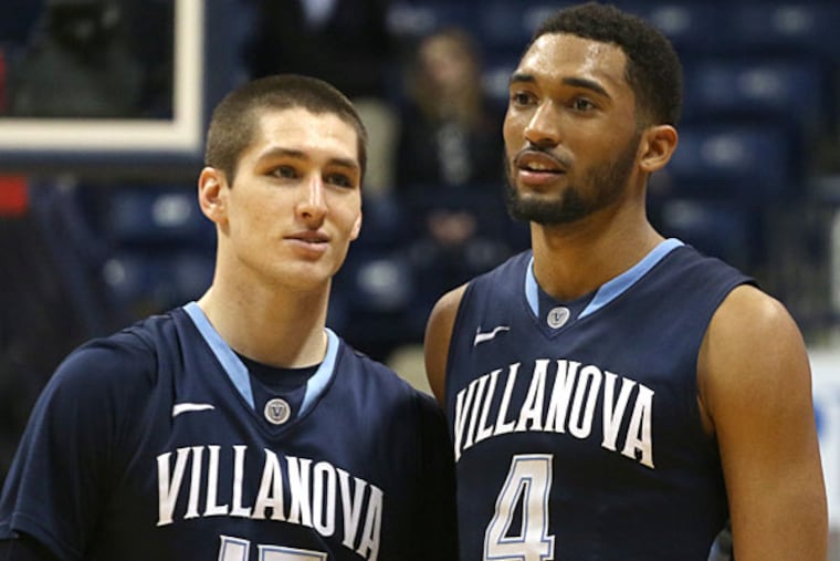Villanova's Darrum Hilliard and Ryan Arcidiacono react near the end of their NCAA college basketball game with Xavier's in Cincinnati Thursday, March 6, 2014. Villanova won 77-70. (Tom Uhlman/AP)