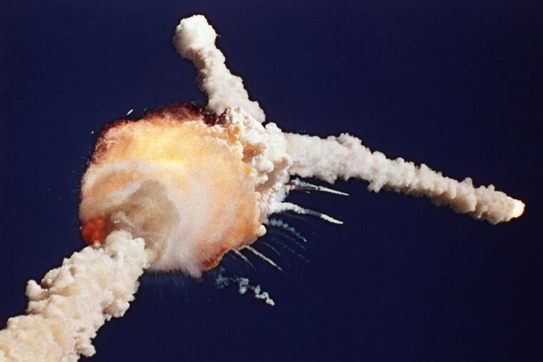 Challenger explodes shortly after liftoff from the Kennedy Space Center in Cape Canaveral, Fla., on Jan. 28, 1986. Christa McAuliffe, inset, was aboard as the first teacher in space.