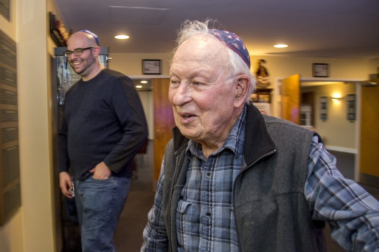 Sid Moszer (right), 93, shares a laugh with Gregory Segarra, 24, one of his former students at Congregation Brothers of Israel synagogue in Newtown.