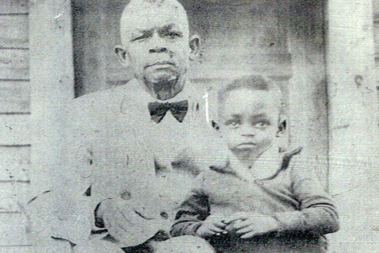 Karin D. Berry's maternal great-grandfather, Charles Brown, with his grandson, Elvin Hudson, in Baton Rouge, La., in the late 1930s. Charles' father was lynched in 1879.