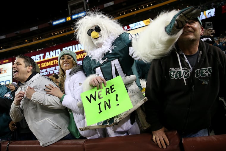 Eagles fans cheer after Sunday's game against the Washington Redskins at FedEx Field in Landover, Md., on Sunday. The Eagles won 24-0 and made the playoffs.