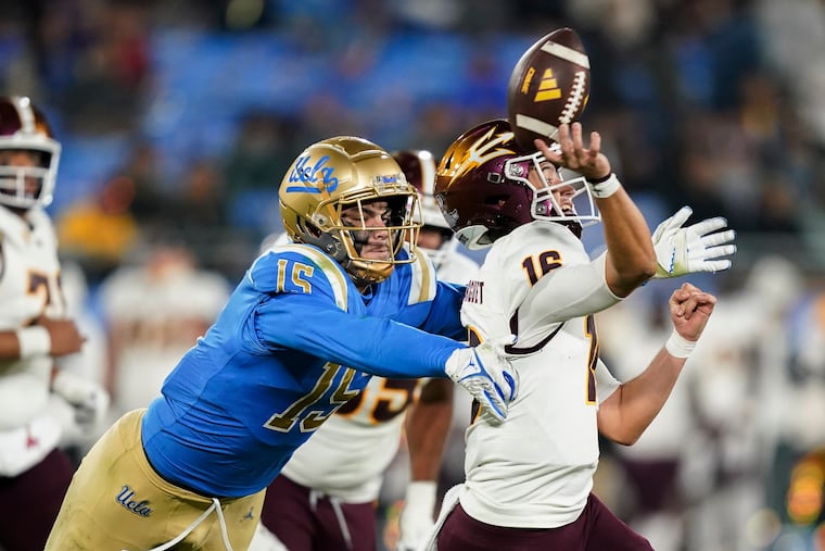 UCLA defensive lineman Laiatu Latu, left, pressures Arizona State quarterback Trenton Bourguet during the second half of an NCAA college football game Nov. 11, 2023, in Pasadena, Calif. (AP Photo/Ryan Sun, File)