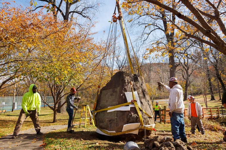 Workers with Sautter Crane Rental Inc. prepare to lift a 36,000-pound rock monument commemorating the encampment of Gen. George Washington's Continental Army at Gulph Mills. It is being removed from a temporary location to its permanent location less than two miles away along South Gulph Road near New Gulph Road, on Friday.