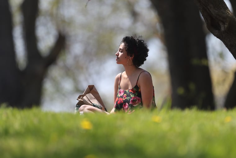 Philadelphia resident Nour Qutyan enjoyed the sun in Lemon Hill in Fairmount Park recently. Though the city has a lot of park space, too little of it is located right where people live, contributing to health inequities.