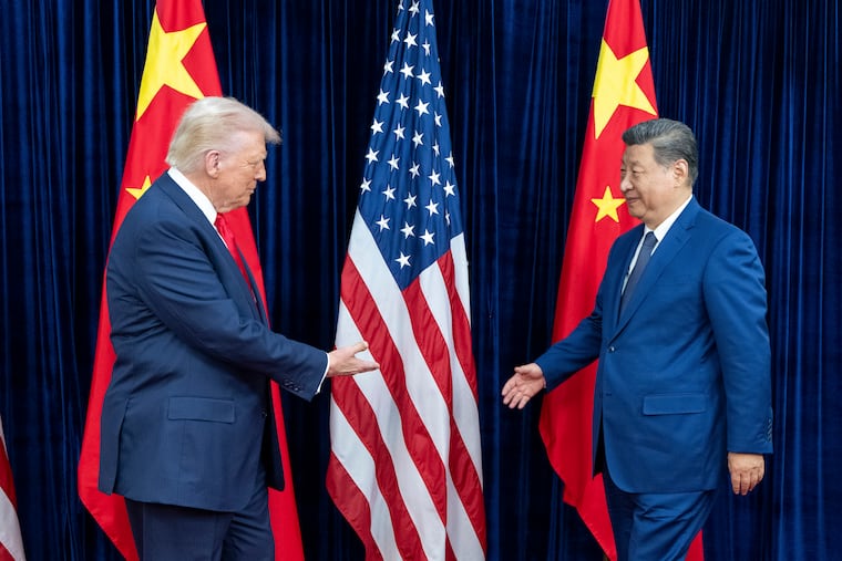President Donald Trump greets President Xi Jinping of China as they meet in Busan, South Korea in October 2025.