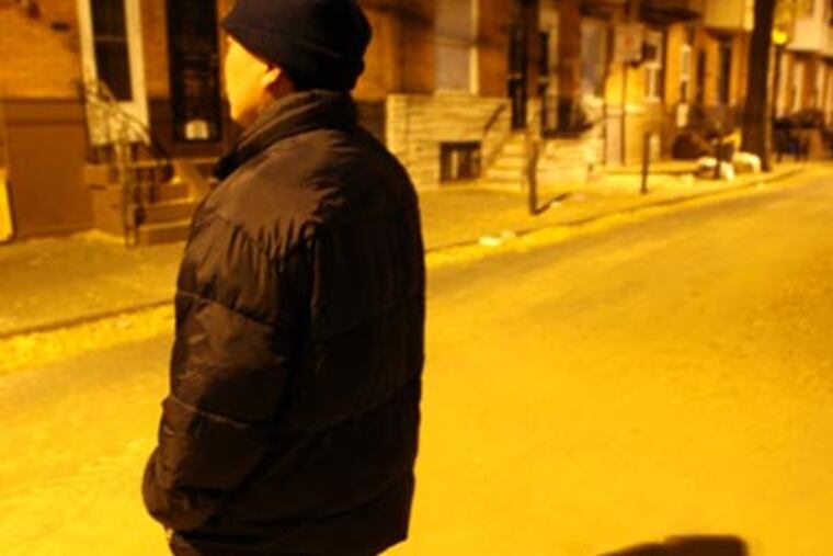 An illegal immigrant worker stands in the middle of his South Philadelphia street. (Yong Kim / Staff Photographer)