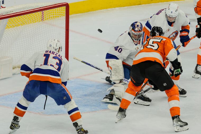 James van Riemsdyk's shot is deflected by Islanders goalie Semyon Varlamov during the third period on Monday.