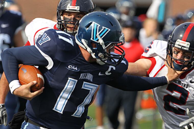 Villanova's Chris Whitney runs for 36 yards as he stiff arms Richmond's Max Prokell. ( Ron Cortes / Staff Photographer )