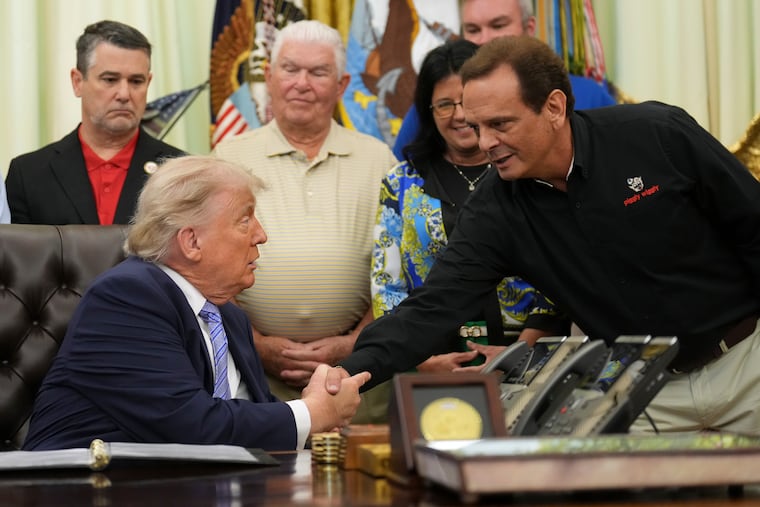 President Donald Trump shakes the hand of Kevin McDaniel, Piggly Wiggly franchise owner, during an event about loosening a federal refrigerant rule Thursday in the Oval Office.