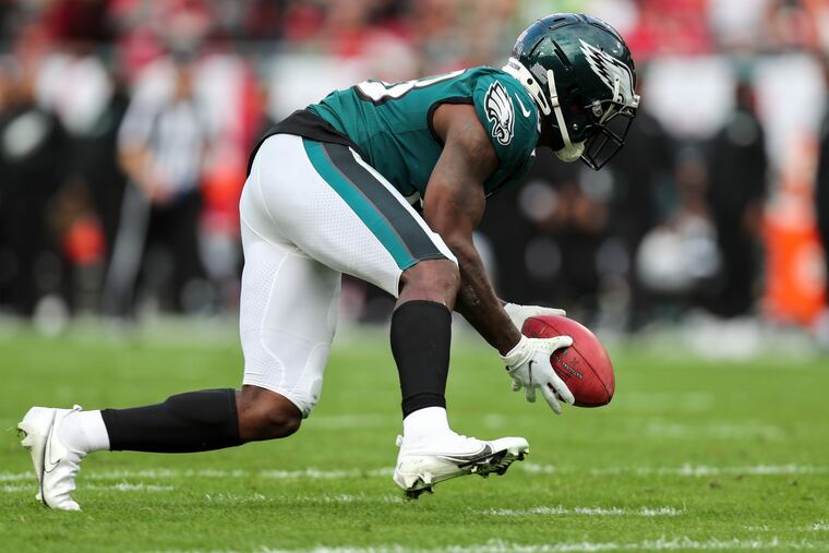 Jalen Reagor recovering the ball after dropping it on a punt return during the Eagles' 31-15 loss to the Buccaneers in their wild-card playoff game last season.