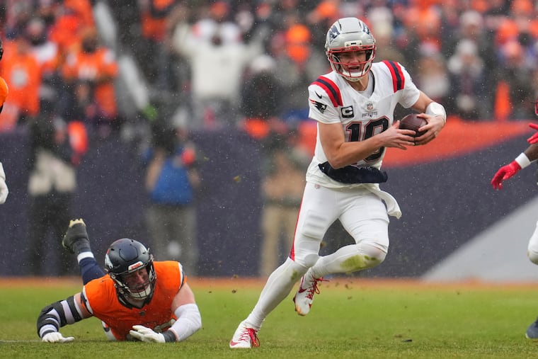 New England Patriots quarterback Drake Maye runs against the Denver Broncos during the second the half of the AFC Championship NFL football game, Sunday, Jan. 25, 2026, in Denver. (AP Photo/Garrett W. Ellwood)