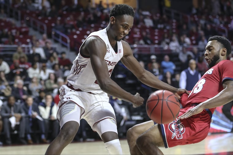 Temple's Shizz Alston Jr. bounces the ball off of Detroit Mercy's Josh McFolley to put the ball out of bounds during the 1st half at The Liacouras Center in Philadelphia Friday, November 9, 2018. STEVEN M. FALK / Staff Photographer