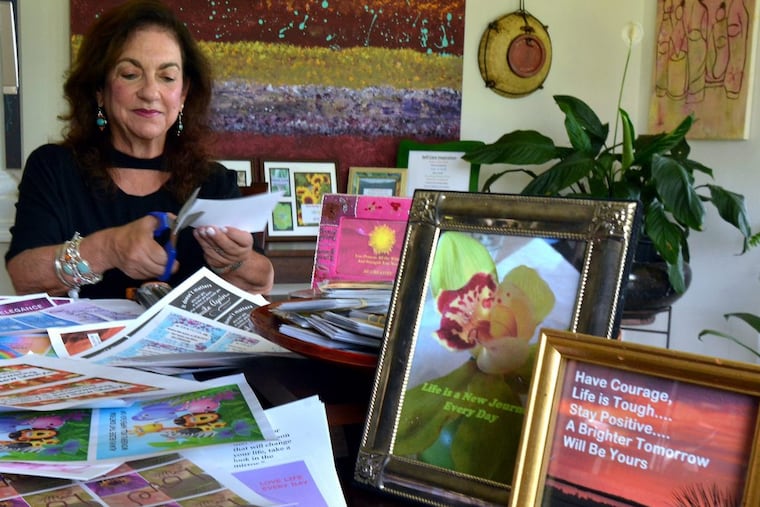 Barbara Mishkin works on inspirational cards in the studio of her home in Upper Gwynedd.