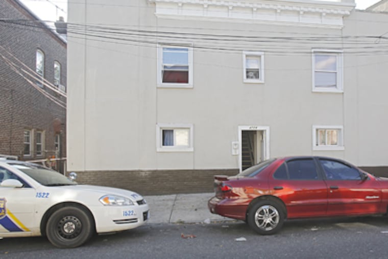 The exterior of the apartment building on Longshore Avenue where police found four adults being held chained. (Akira Suwa / Staff Photographer)