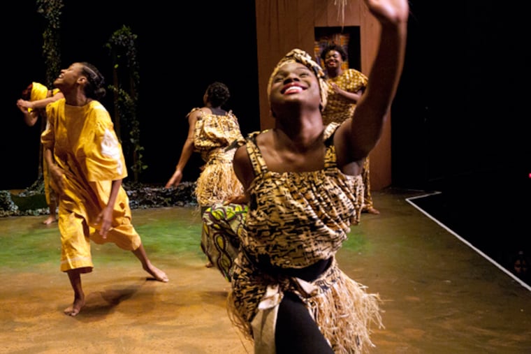 Camden's Universal African Dance and Drum Ensemble of Unity Community Center and the Camden Repertory Theater collaborate to put on an original African musical, Mufaro's Beautiful Daughters at Rutgers' Gordon Theater on Dec. 12, 2013. Here, Maia Kelly-Miller on stage. (APRIL SAUL/Staff)