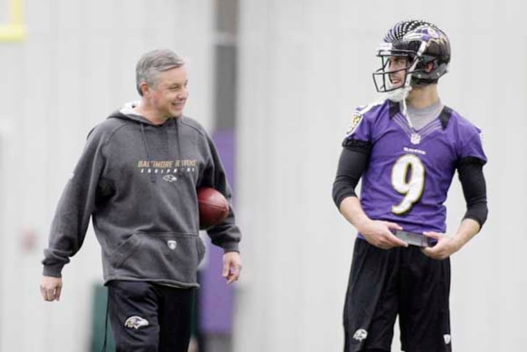 Baltimore Ravens kicking consultant Randy Jones (left) and kicker Justin Tucker walk off the field at the Baltimore Ravens' practice facility in Owings Mills, MD on November 28, 2012. ( ELIZABETH ROBERTSON / Staff Photographer )