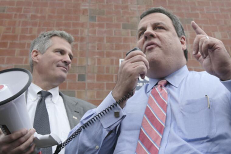 New Jersey Gov. Chris Christie, right, is flanked by U.S. Sen. Scott Brown, R-Mass., as he talks to supporters at a campaign stop for Brown in Watertown, Mass., Wednesday, Oct. 24, 2012. (AP Photo/Charles Krupa)