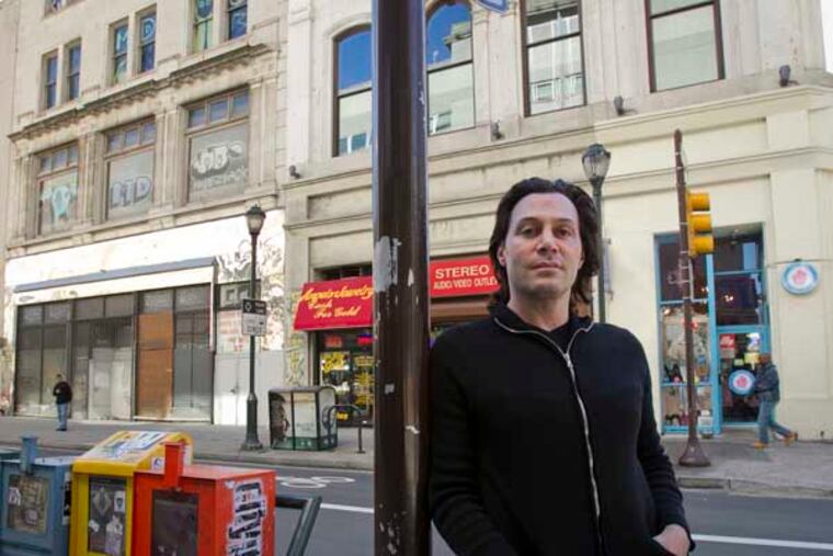 John Columbo, owner of Philly Cupcake located on southeast corner of Chestnut St. at 12th in center city Philadelphia. Photograph of John and blight along 1100 of Chestnut St. in Philadelphia as seen on Tuesday, October 15, 2013. ( ALEJANDRO A. ALVAREZ / STAFF PHOTOGRAPHER )