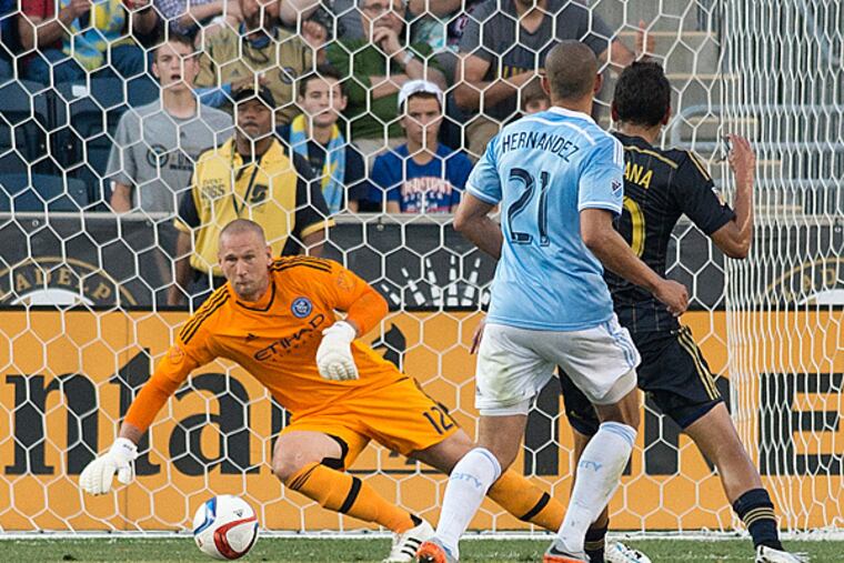 New York City FC goalkeeper Josh Saunders (12) saves Philadelphia Union midfielder Cristian Maidana (10) shot during the first half at PPL Park. (Tommy Gilligan/USA TODAY Sports)
