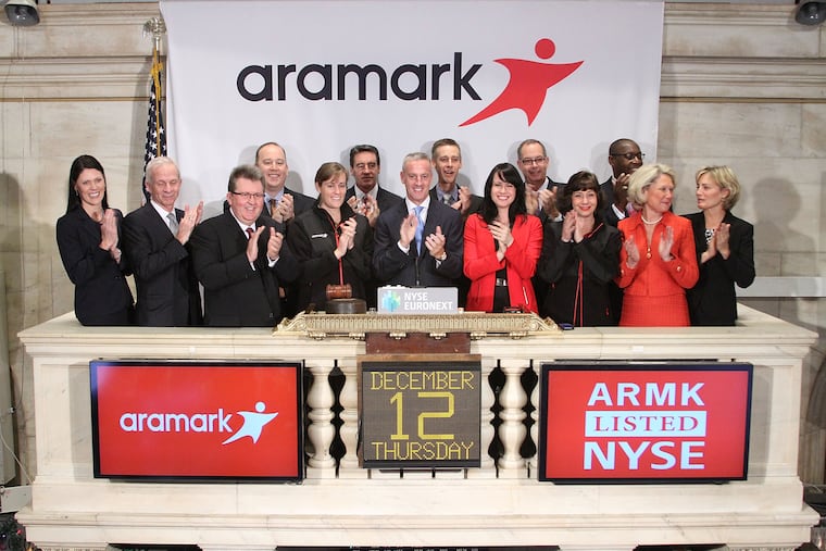 FILE photo shows Eric Foss, President and Chief Executive Officer of Aramark ringing the Opening Bell at the New York Stock Exchange on December 12, 2013. Aramark has been in the news for not paying bonuses to thousands of managers and the lack of communication around it. (Photo by Ben Hider/NYSE Euronext)