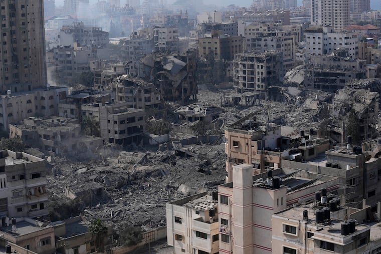 Destruction from Israeli aerial bombardments is seen in Gaza City on Oct. 11. After 11 weeks of war in Gaza, the Palestinian death toll is approaching 23,000, and satellite data show that a third of the structures across the enclave have been destroyed.