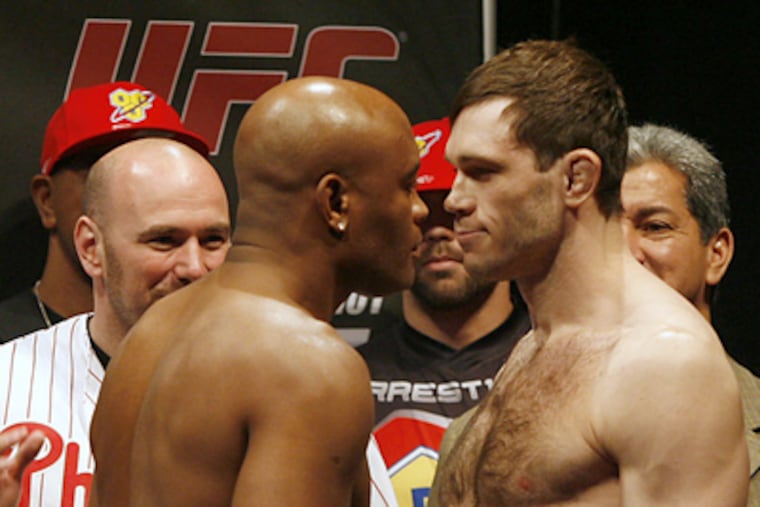 Facing off at their weigh-in on Friday is UFC middleweight champion Anderson Silva, left, and his opponent Forrest Griffin. They meet at tonight's UFC 101 event at the Wachovia Center. (Alejandro A. Alvarez / Staff Photographer)