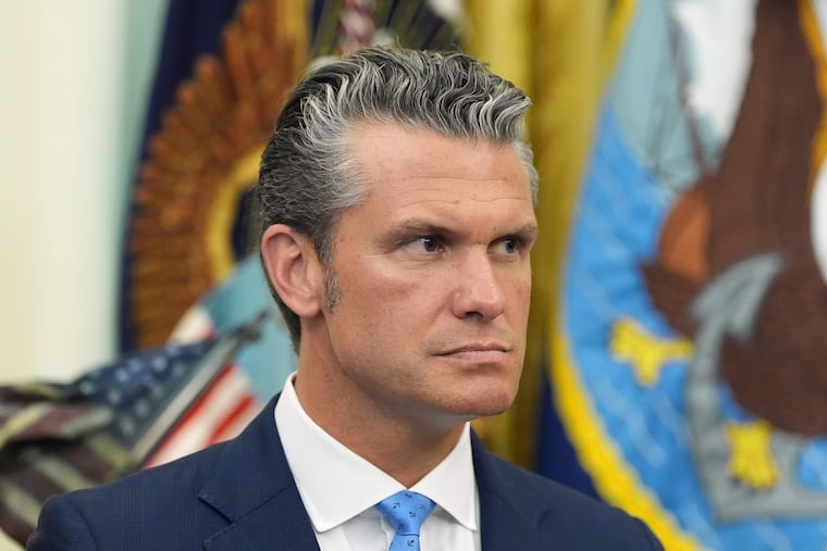 Defense Secretary Pete Hegseth listens as President Donald Trump speaks during a meeting about military families, in the Oval Office of the White House, Monday, Aug. 3, 2026, in Washington.