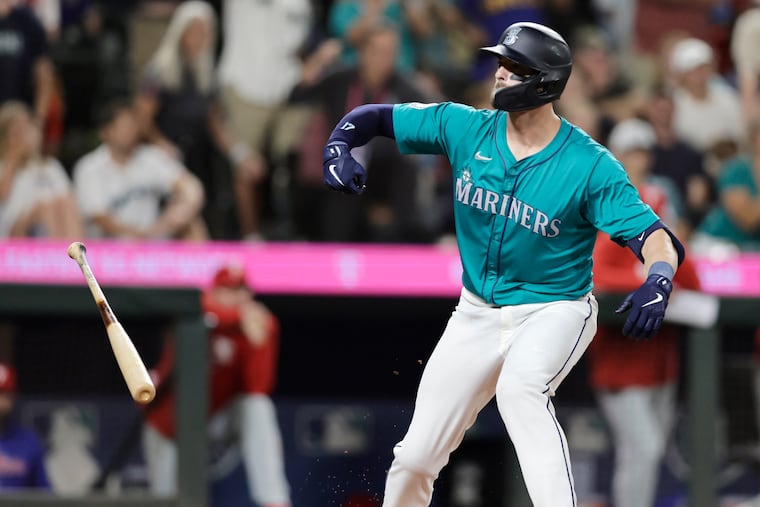Seattle Mariners Mitch Haniger reacts after drawing a walk-off walk during the 10th inning to defeat the Phillies, 6-5, in their game on Saturday in Seattle.