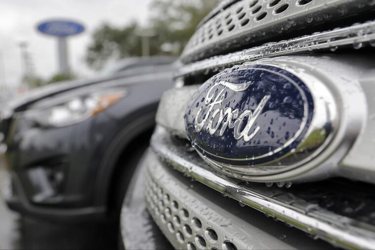 Ford vehicles sit on a Florida dealership lot.