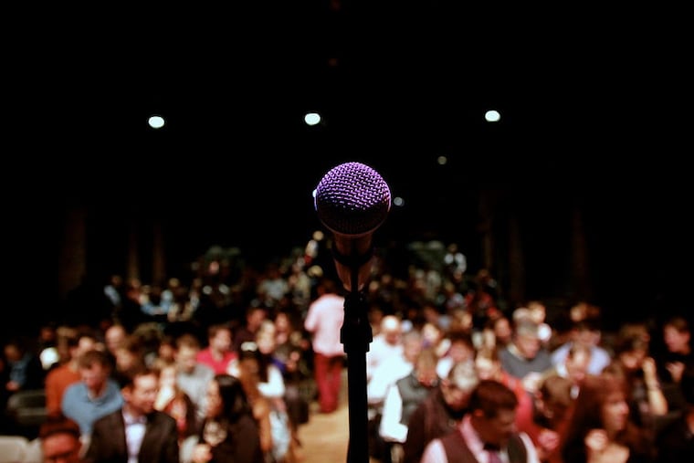 A photograph from First Person Arts' annual Ex-Files StorySlam. The mics will be quiet this spring as the nonprofit waits for final word on the funding it was expecting from the National Endowment for the Arts.