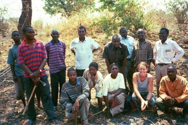 Lara Weber, front row second from right, meets with an agriculture group in her village near Chama, Zambia, while serving as a Peace Corps volunteer. The aid program still matters, writes Jonathan Zimmerman.