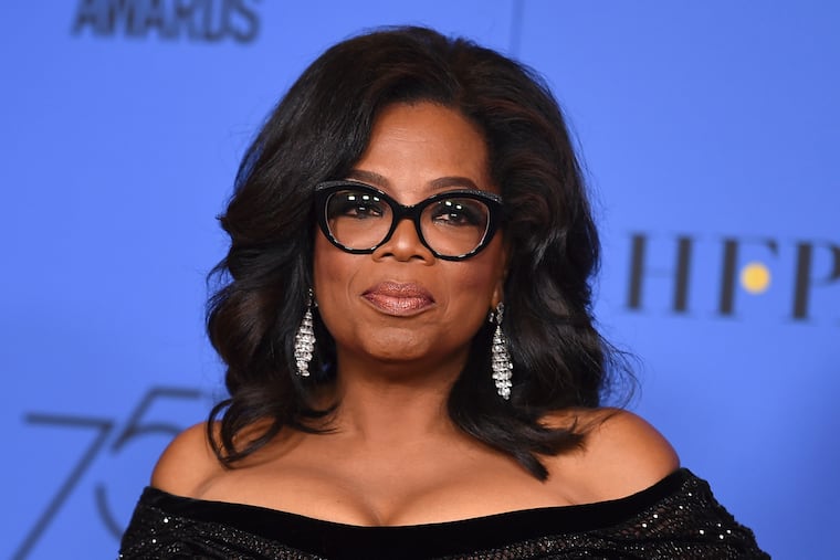 FILE - In this Jan. 7, 2018 file photo, Oprah Winfrey poses in the press room with the Cecil B. DeMille Award at the 75th annual Golden Globe Awards in Beverly Hills, Calif. Winfrey will interview two men who say Michael Jackson sexually abused them as boys immediately after a documentary on the men. HBO and the Oprah Winfrey Network announced Wednesday that “After Neverland,” will air on both channels Monday at 10 p.m. Eastern and Pacific.